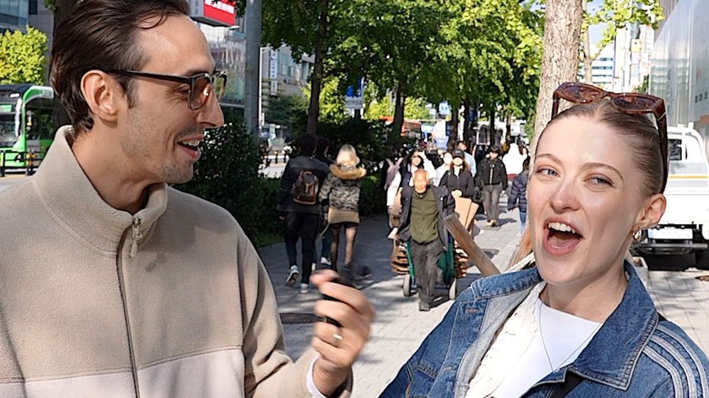 An interviewee laughing while Sean holds the mic